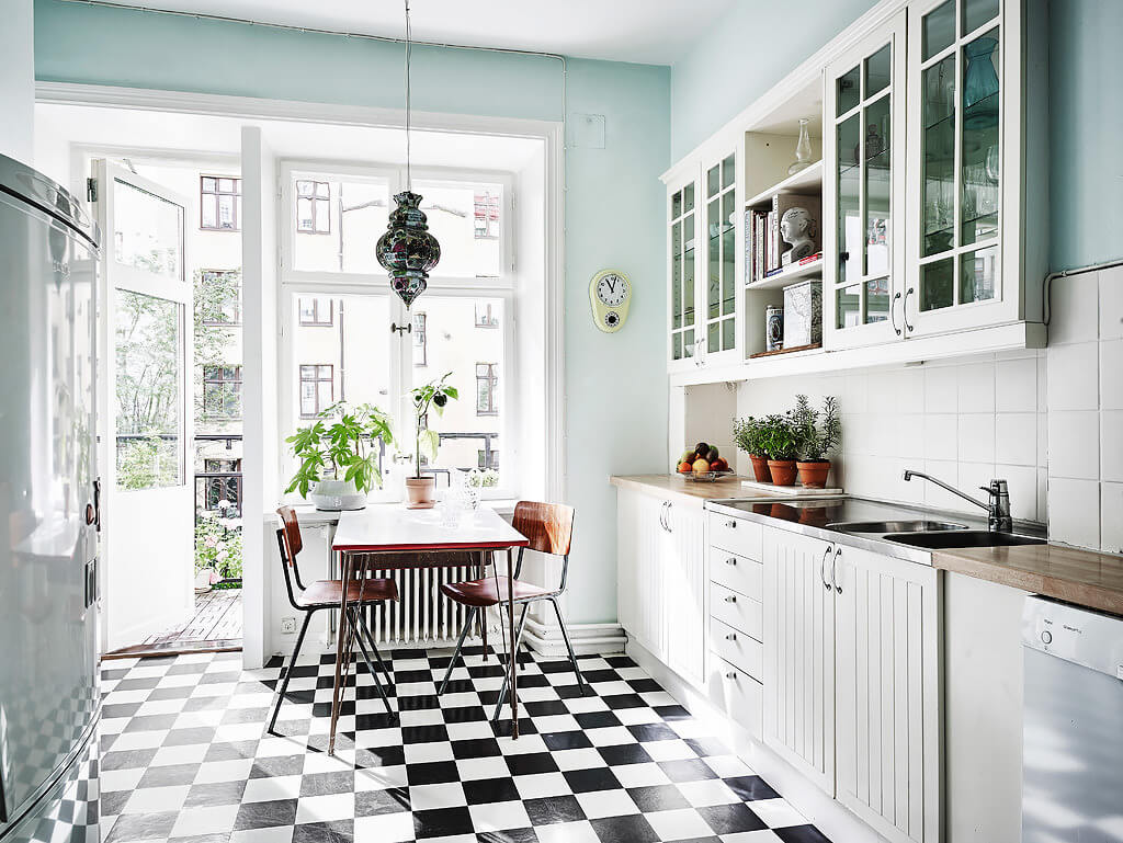kitchen-light-blue-walls-white-cabinets-checkerboard-floor-nordroom