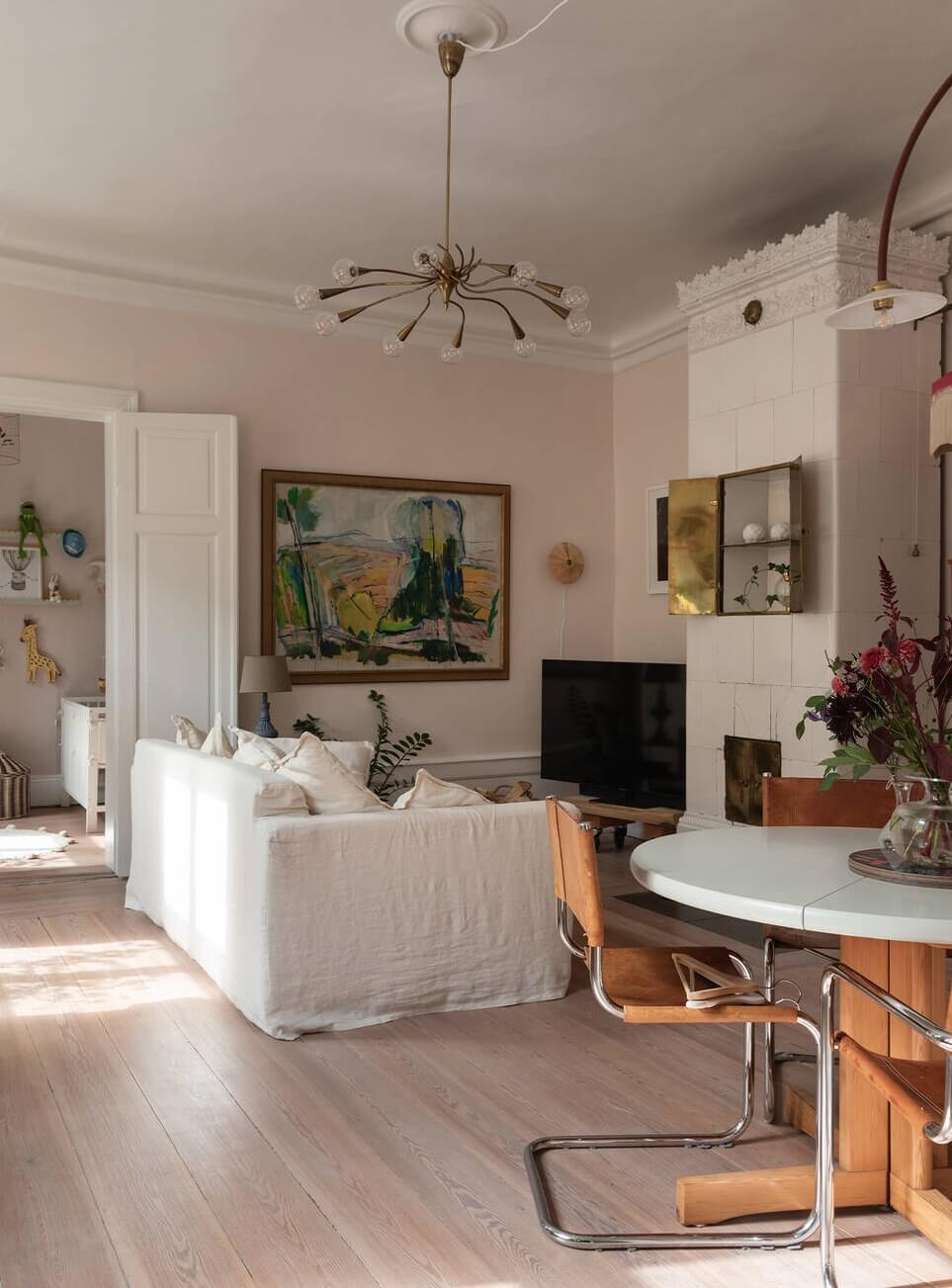 A Lovely Swedish House Revisited 1 light-living-room-fireplace-round-dining-table-nordroom
