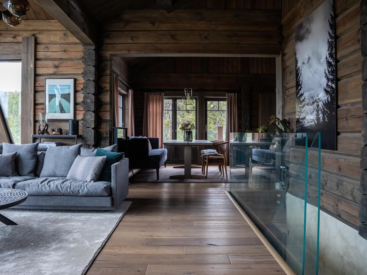 log-house-open-plan-living-room-wooden-walls-nordroom