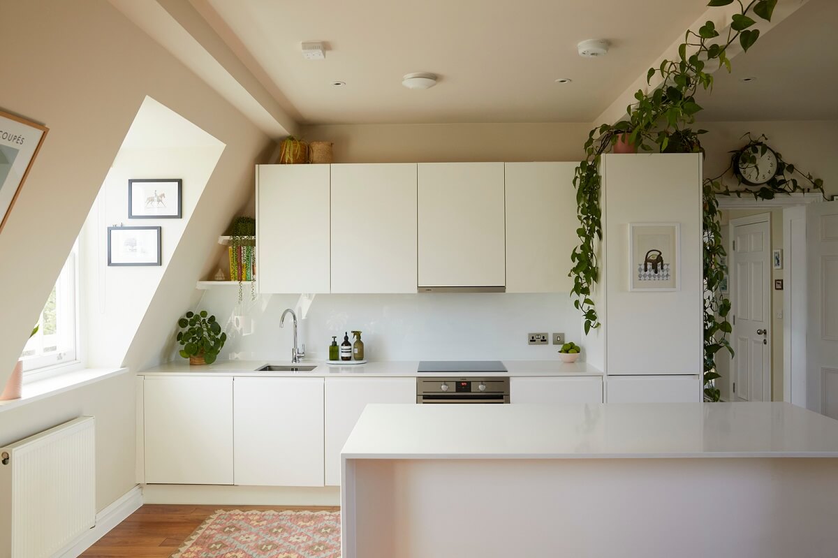 modern-white-kitchen-with-island-hanging-plants-nordroom