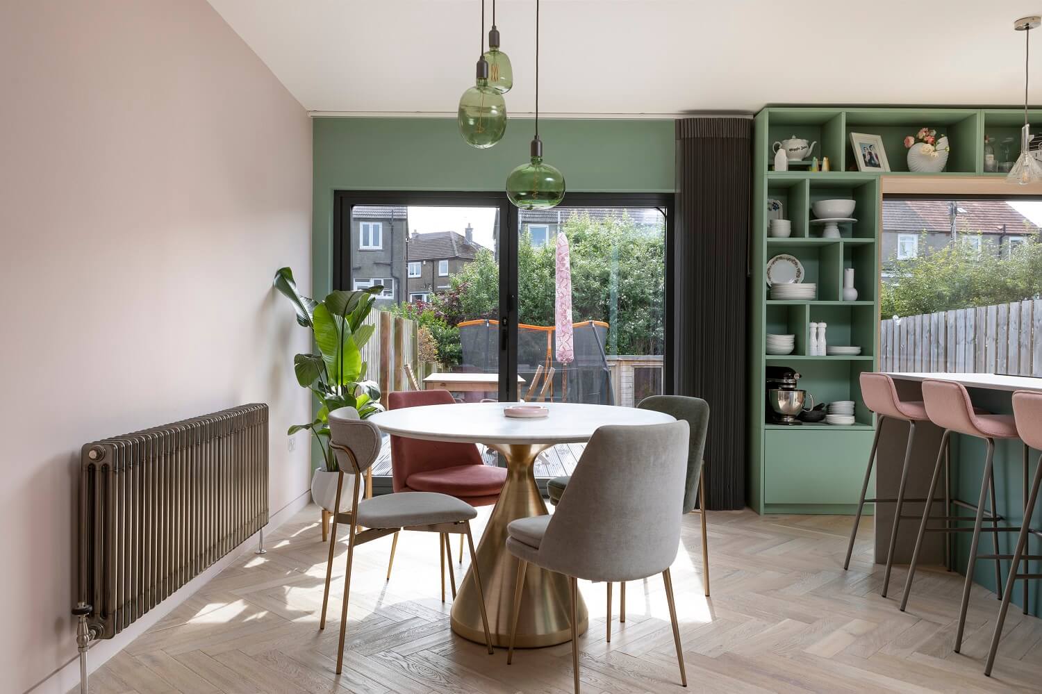 round-dining-table-green-pink-open-plan-living-kitchen-agora-nordroom