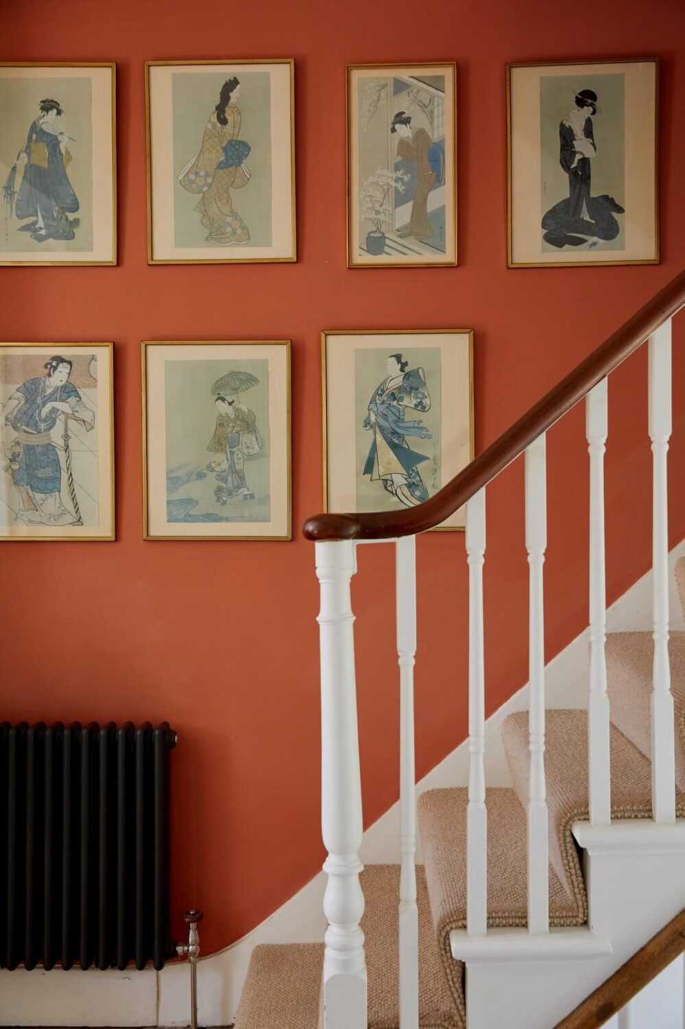 terracotta-wall-color-gallery-wall-staircase-nordroom