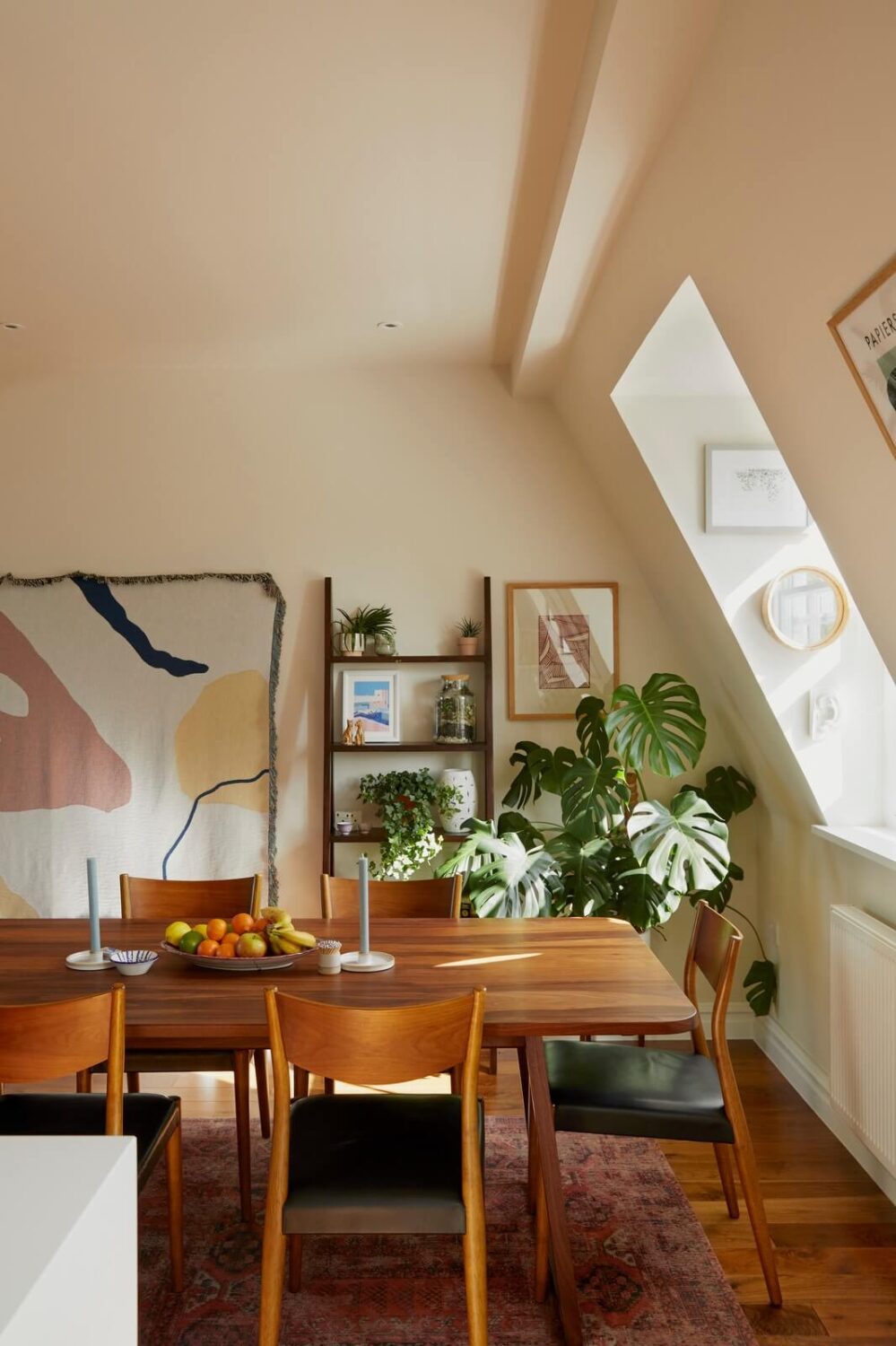 wooden-dining-table-slanted-ceiling-attic-apartment-nordroom
