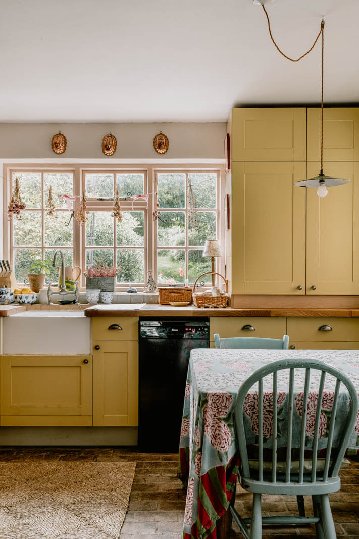 yellow-cabinets-english-cottage-kitchen-nordroom