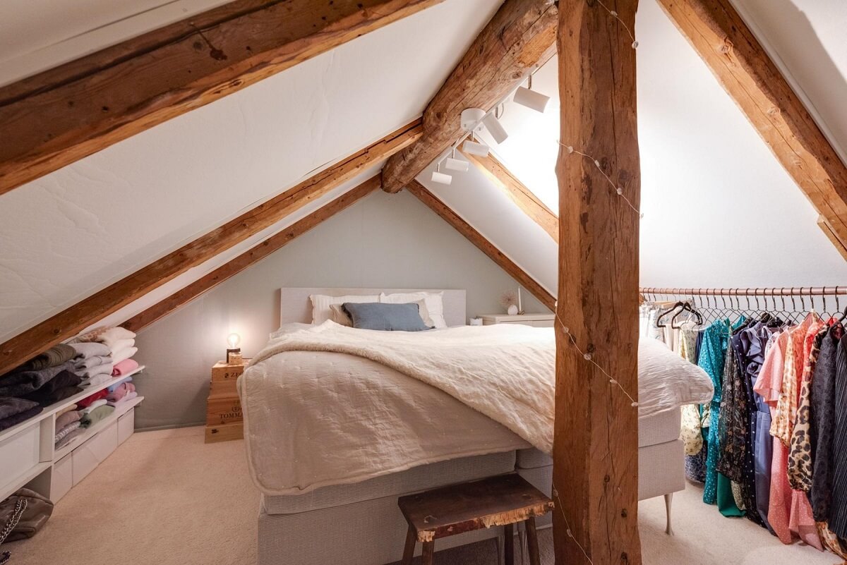 attic bedroom slanted ceiling wooden beams