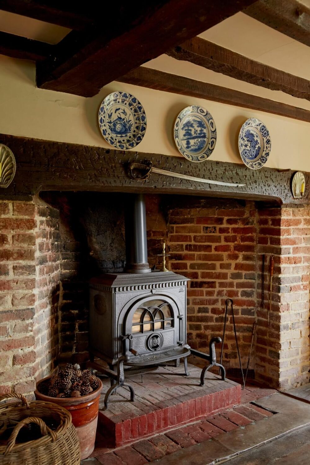 brick fireplace exposed beams cottage