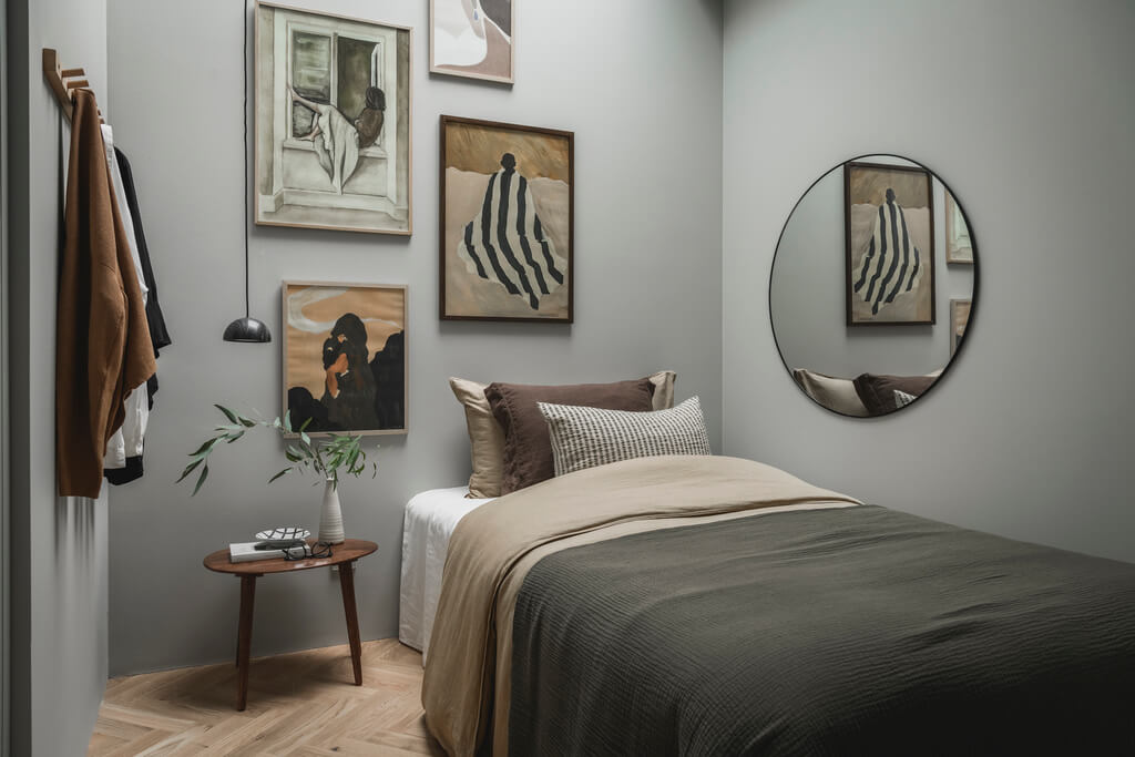 light-gray-bedroom-gallery-wall-round-mirror-nordroom