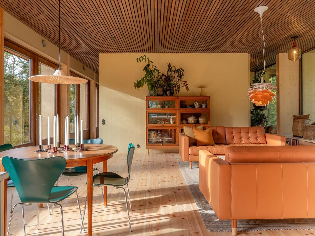 open-plan-living-room-wooden-ceiling-pale-yellow-walls-nordroom