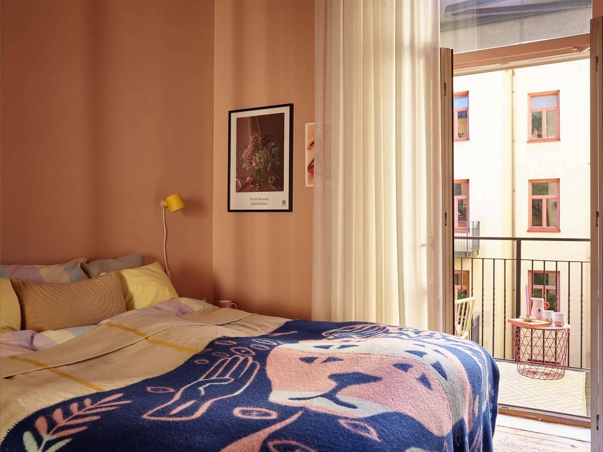 pink-bedroom-balcony-blue-throw-nordroom