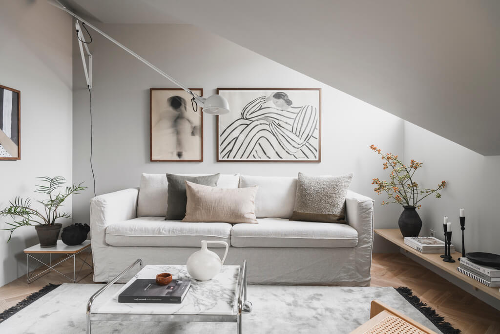 white-scandinavian-living-room-slanted-ceiling-nordroom