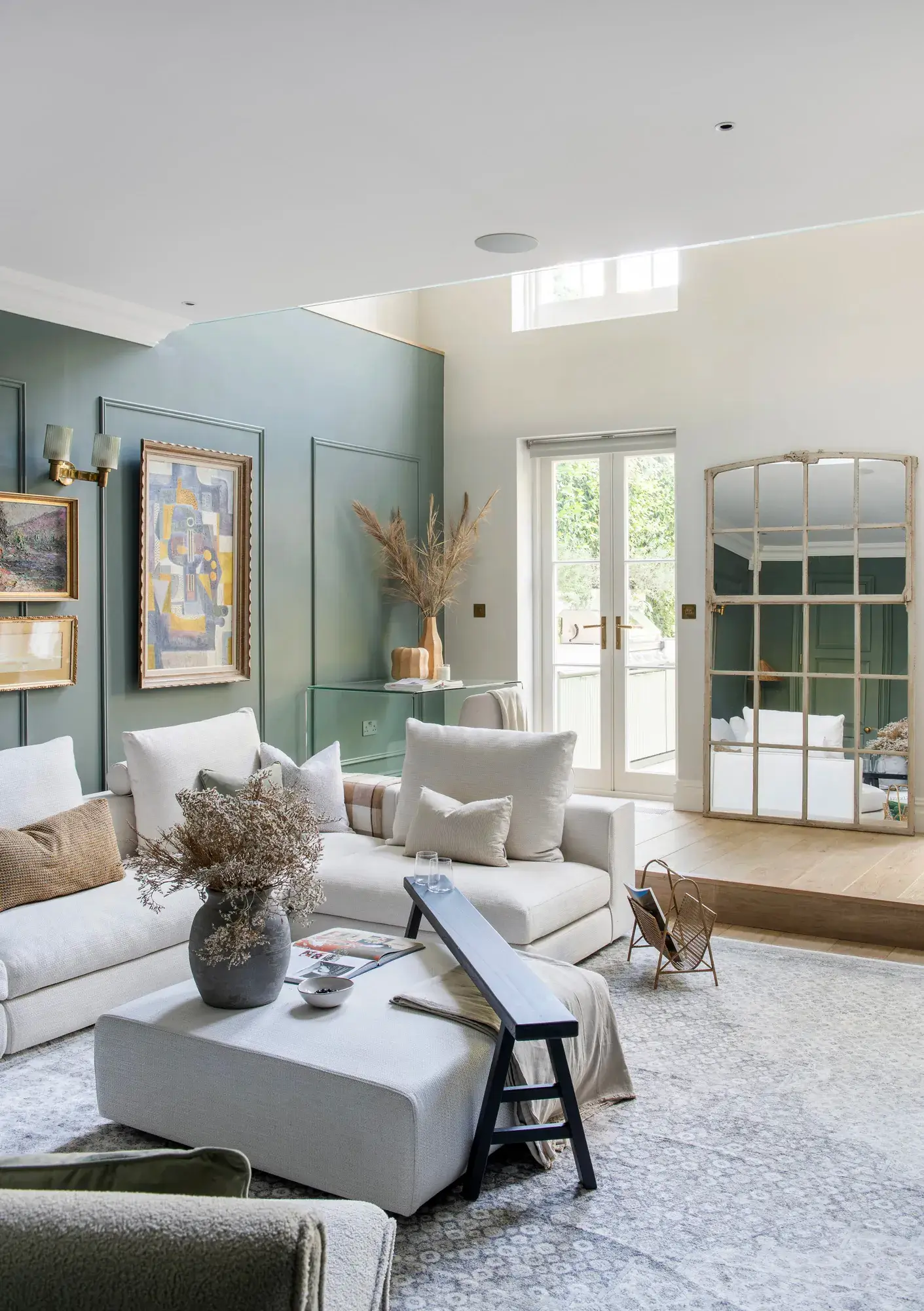 Little-Venice-Apartment-living-room-muted-blue-walls-white-furniture-nordroom