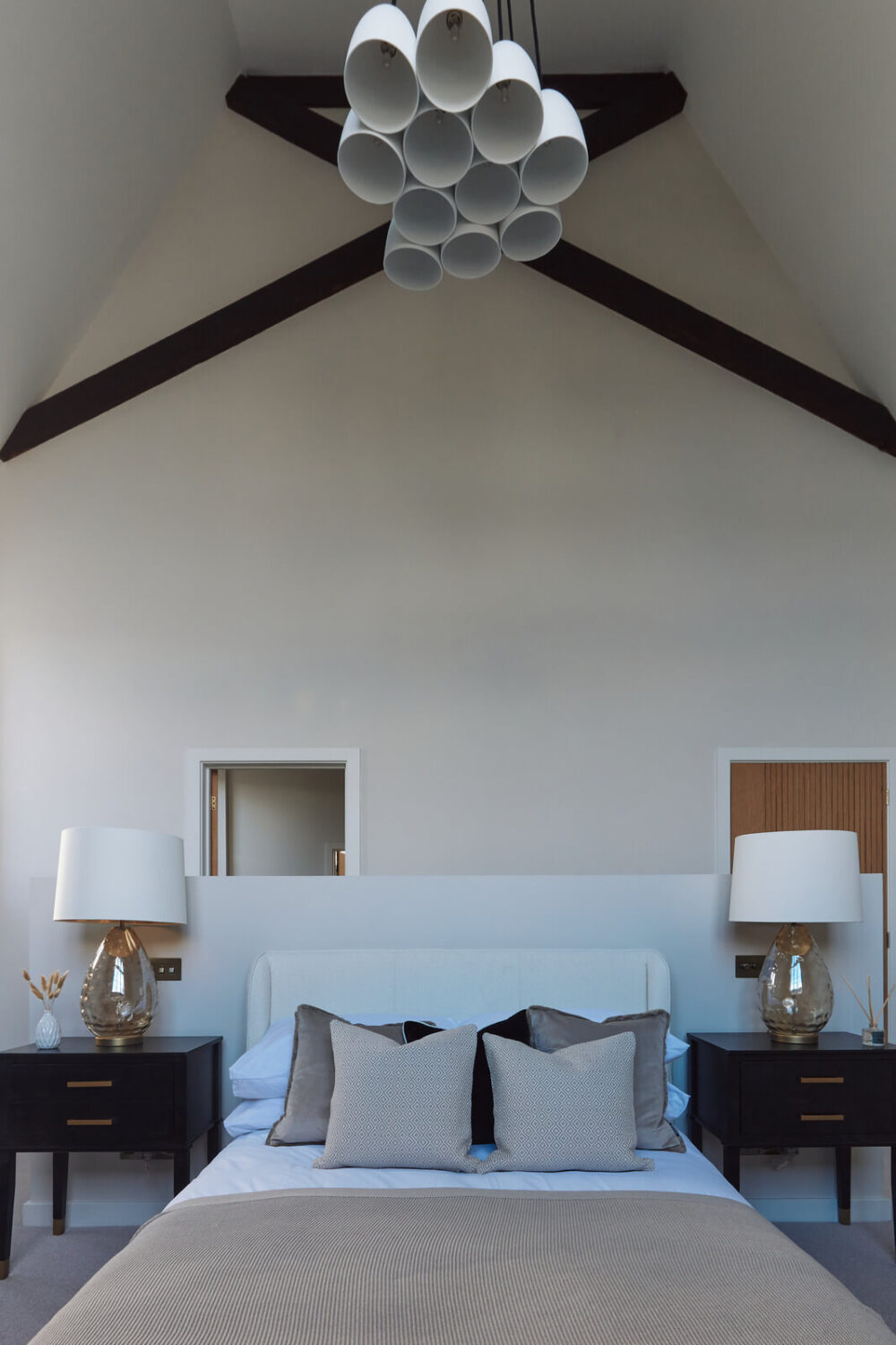 bedroom-high-pitched-ceiling-exposed-beams-nordroom