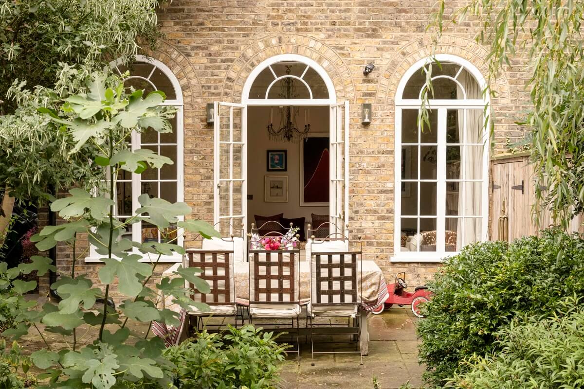 green city garden dining space arched windows nordroom