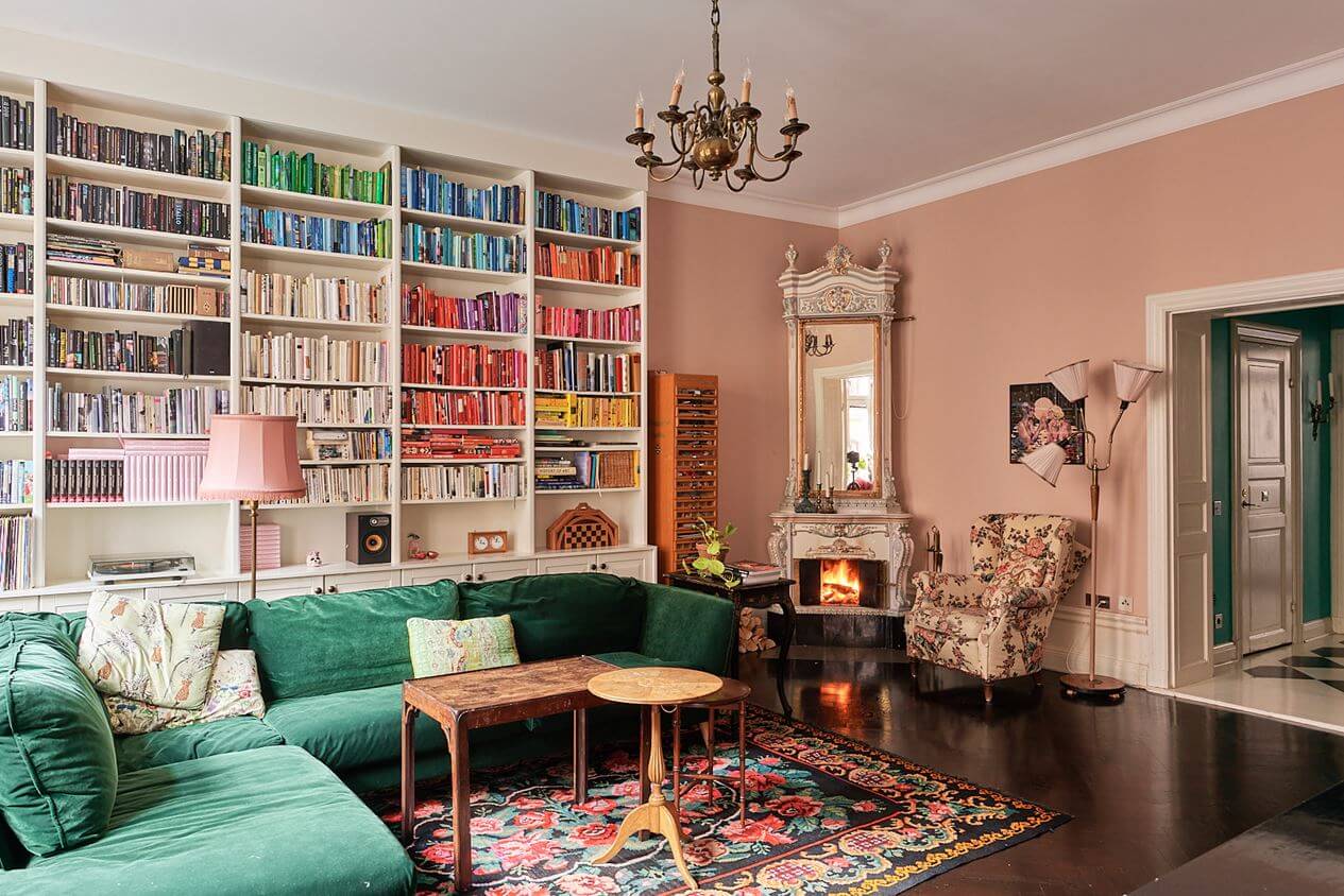 green-corner-sofa-bookshelves-pink-walls-nordroom