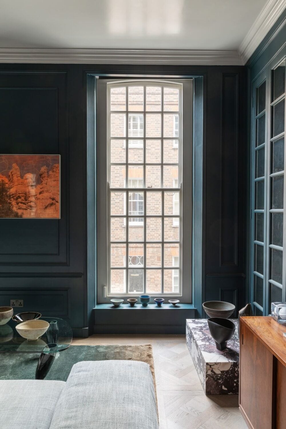 A Unique London Home with Terrazzo Tiles and a Roof Terrace 2 large window dark blue sitting room