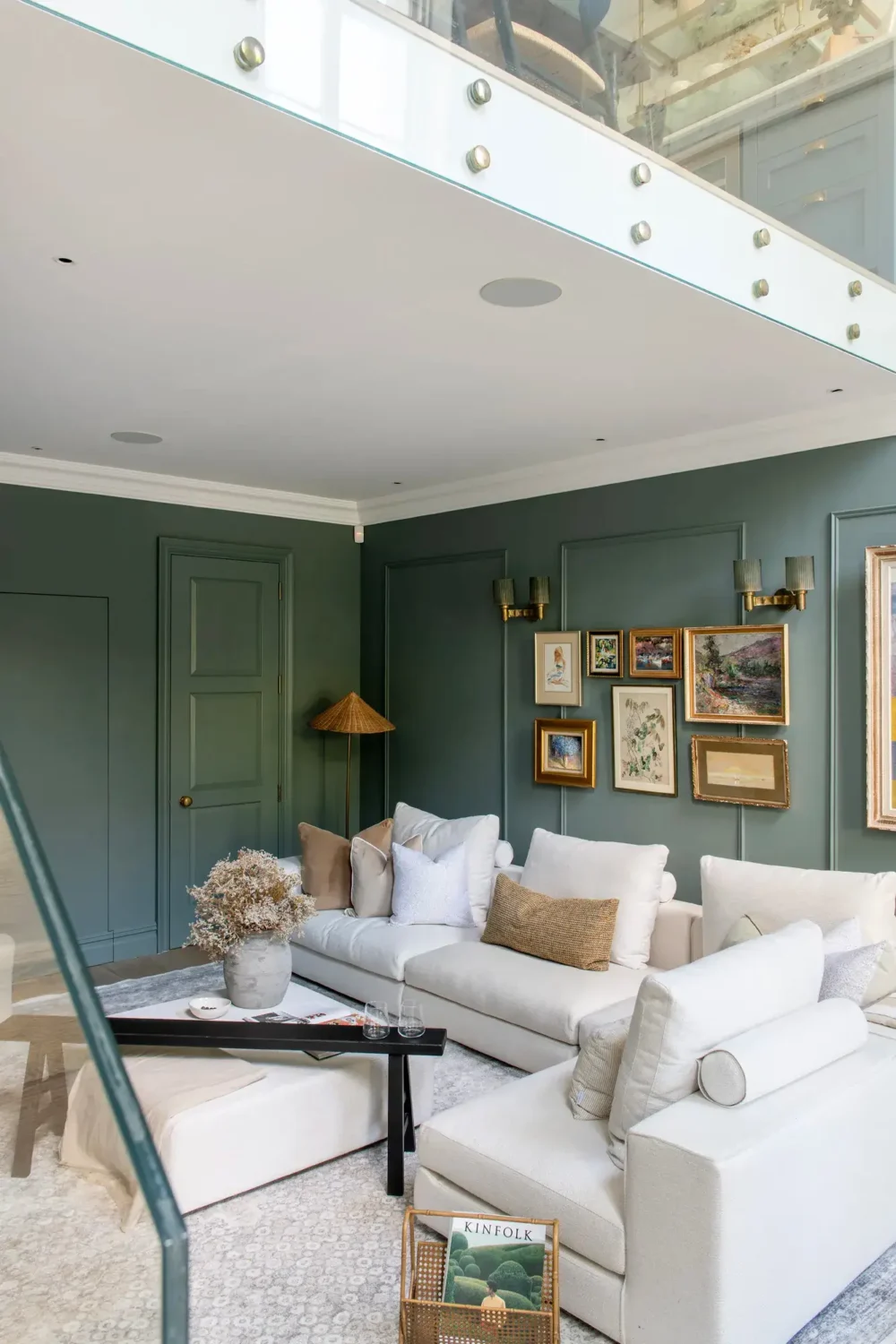living-room-muted-blue-walls-vintage-art-white-furniture-nordroom