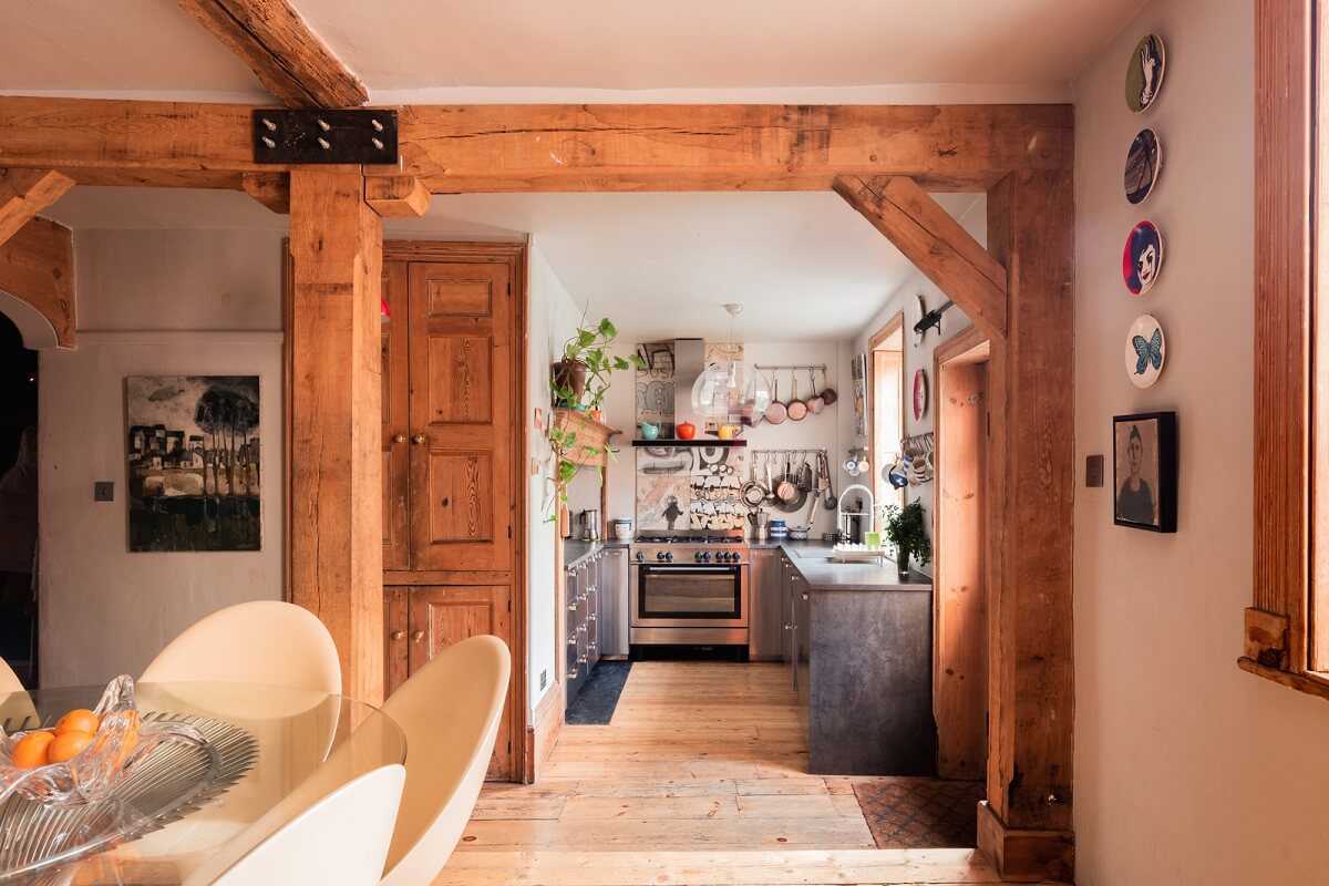 open plan kitchen dining room exposed wooden beams