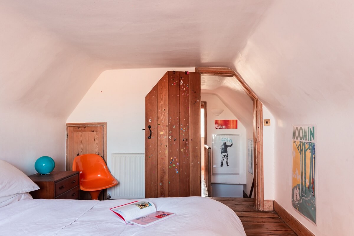 white attic bedroom wooden door