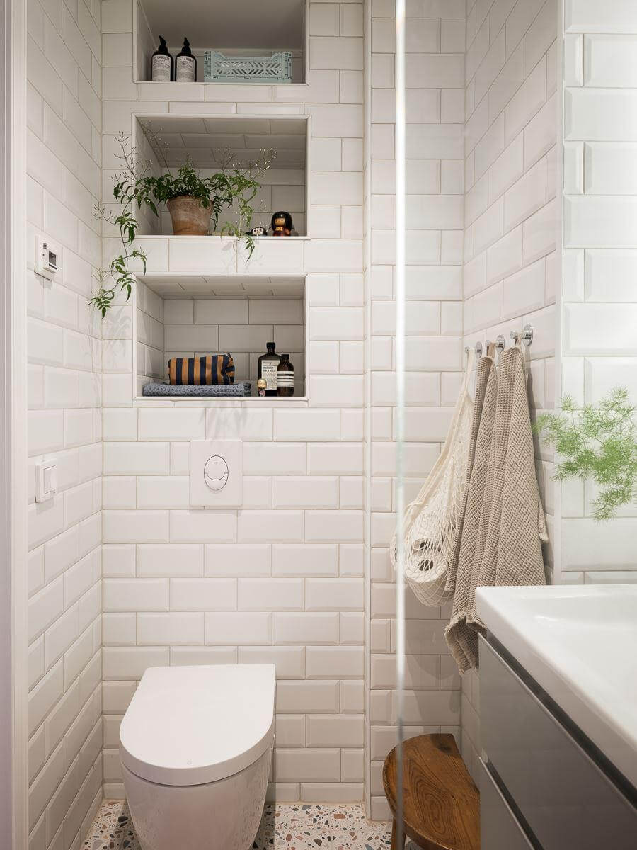 bathroom white tiles storage niches nordroom