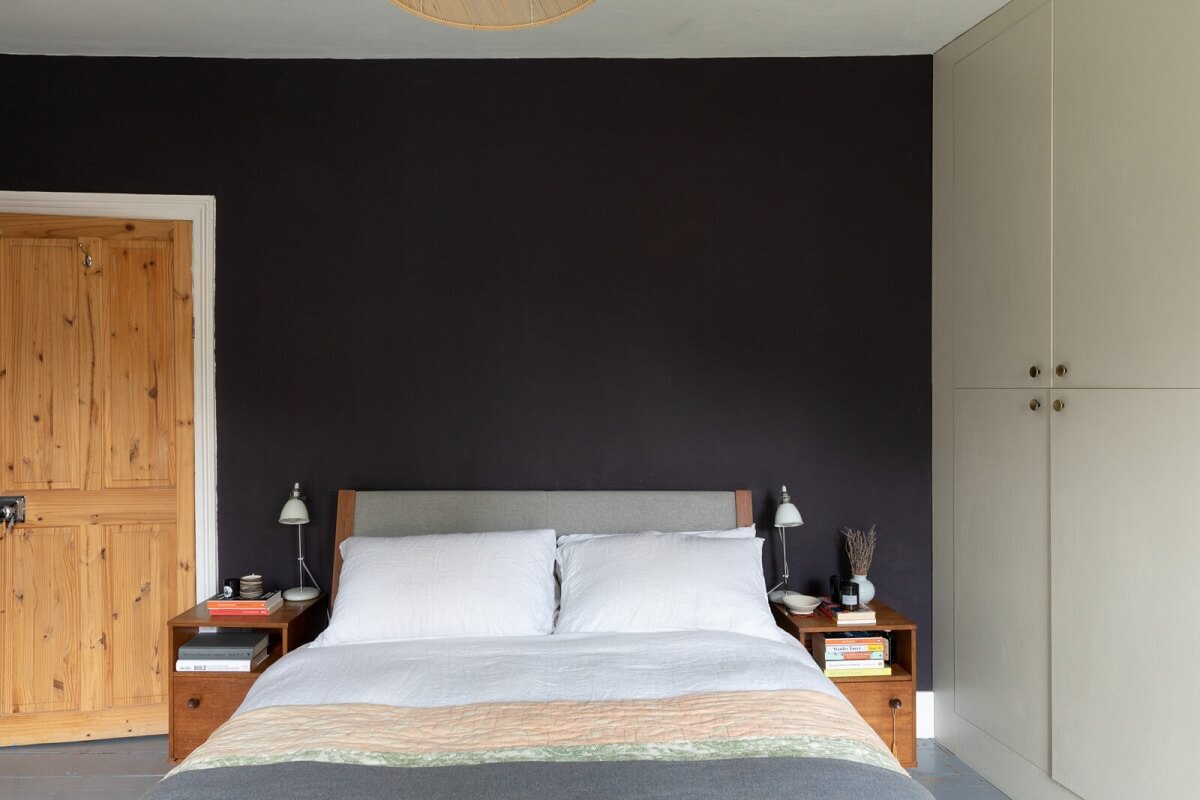 black feature wall built in wardrobes bedroom