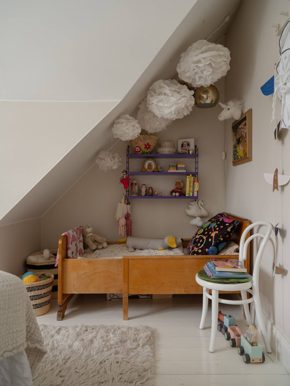 children room slanted ceiling wall shelves nordroom
