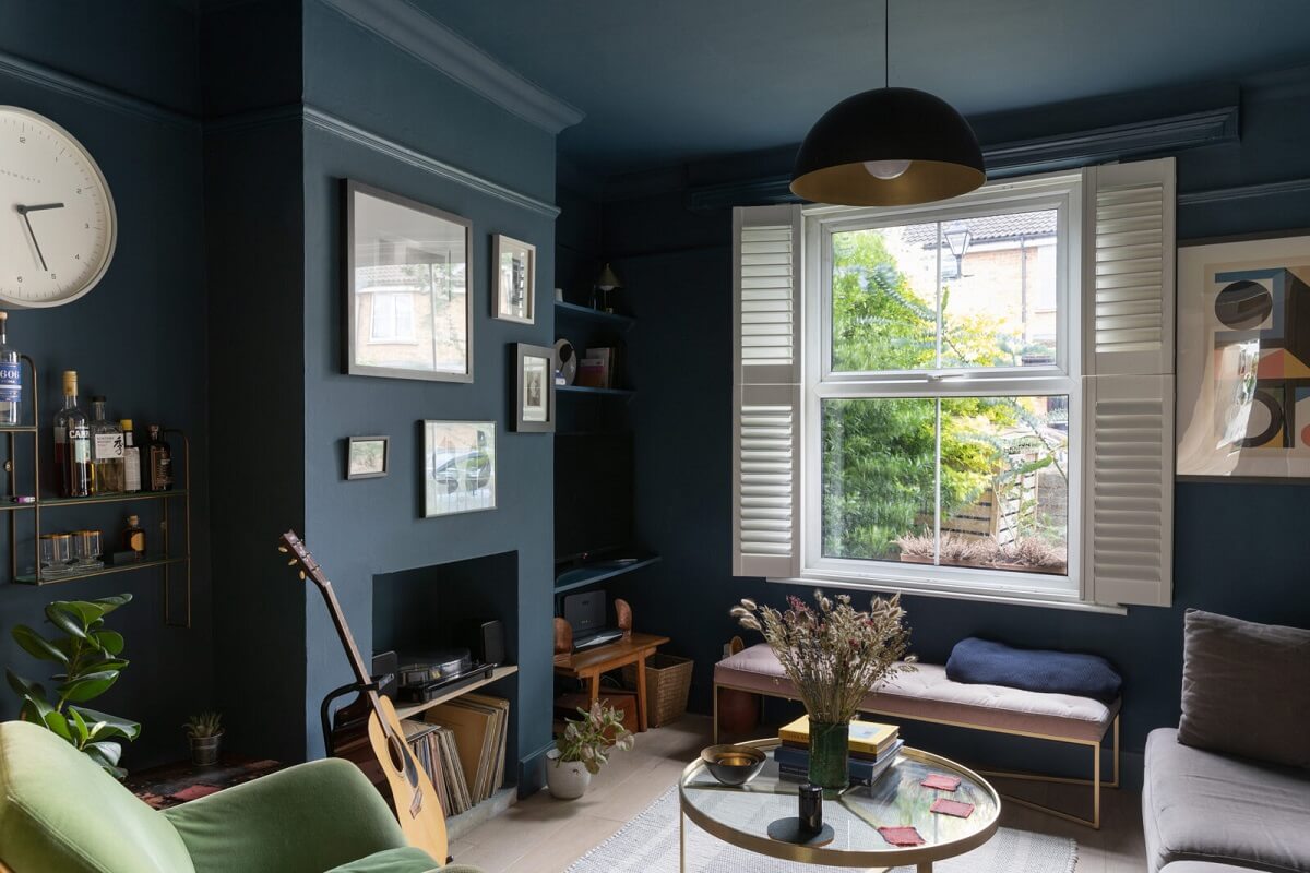 dark blue living room shutters fireplace nordroom