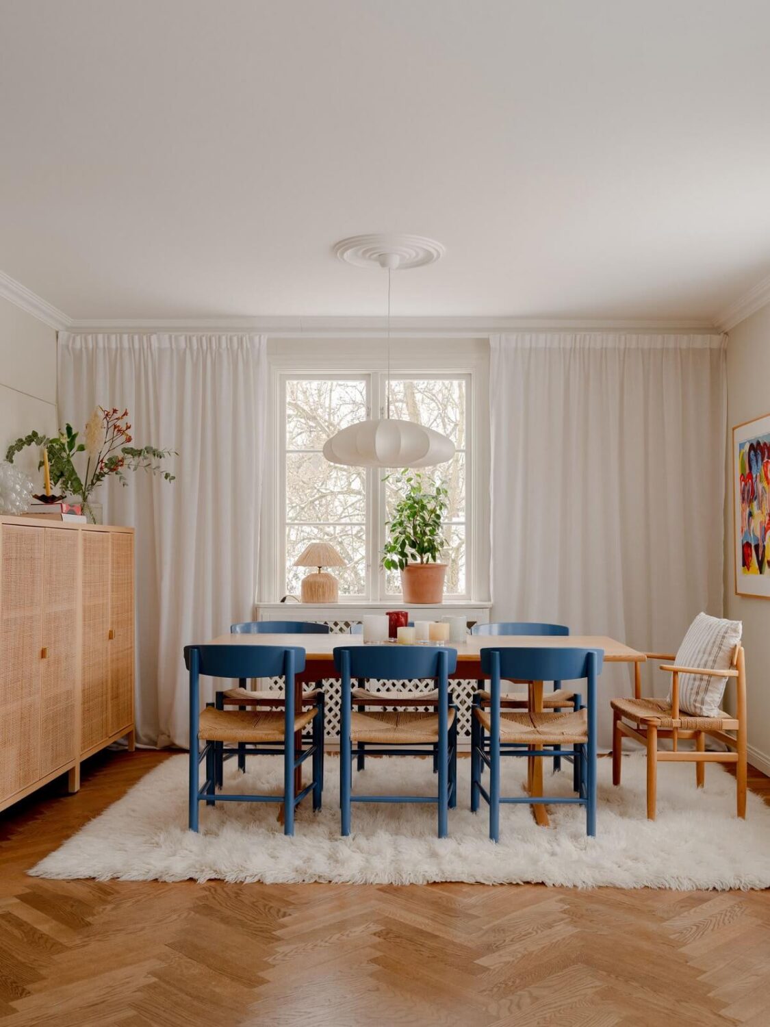 dining area with large rug and blue dining chairs nordroom