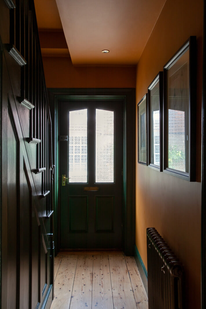 hallway-orange-brown-walls-green-front-door-nordroom