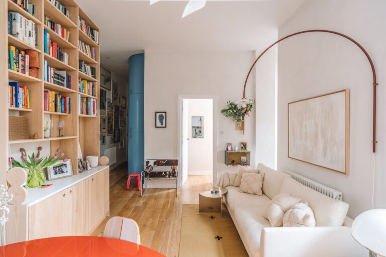 High Ceilings and Modern Design in a Light London Apartment - The Nordroom - Apartment Design With High Ceilings And A Large Built-In Bookshelf