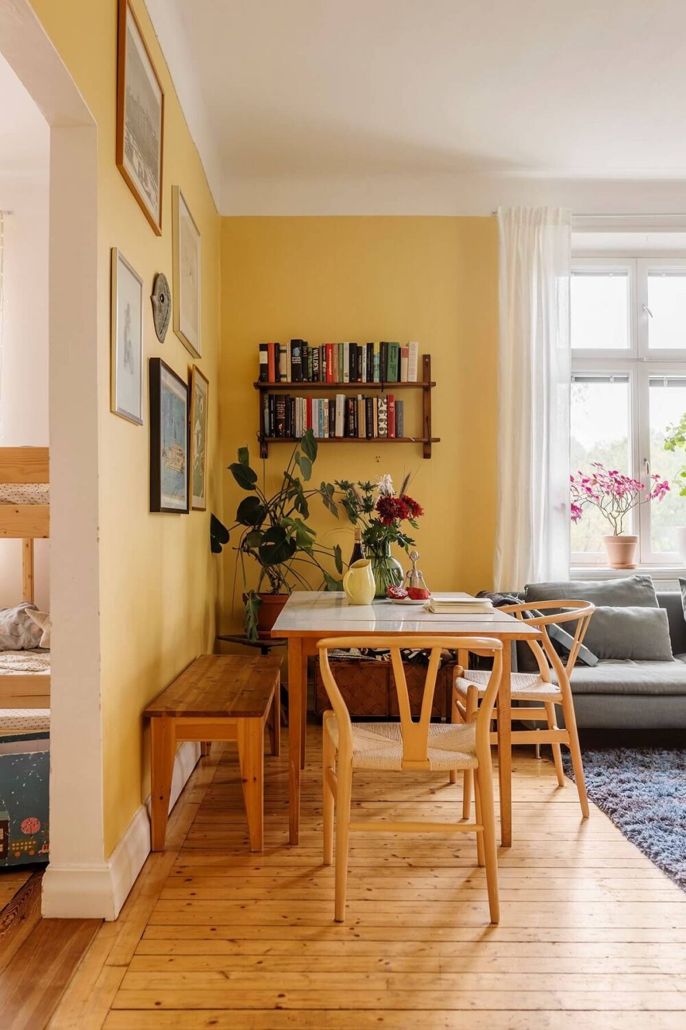 living room dining table wooden floor yellow walls nordroom