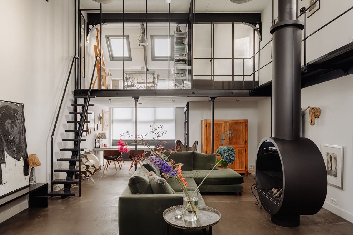 living-space-green-sofa-fireplace-industrial-loft-nordroom