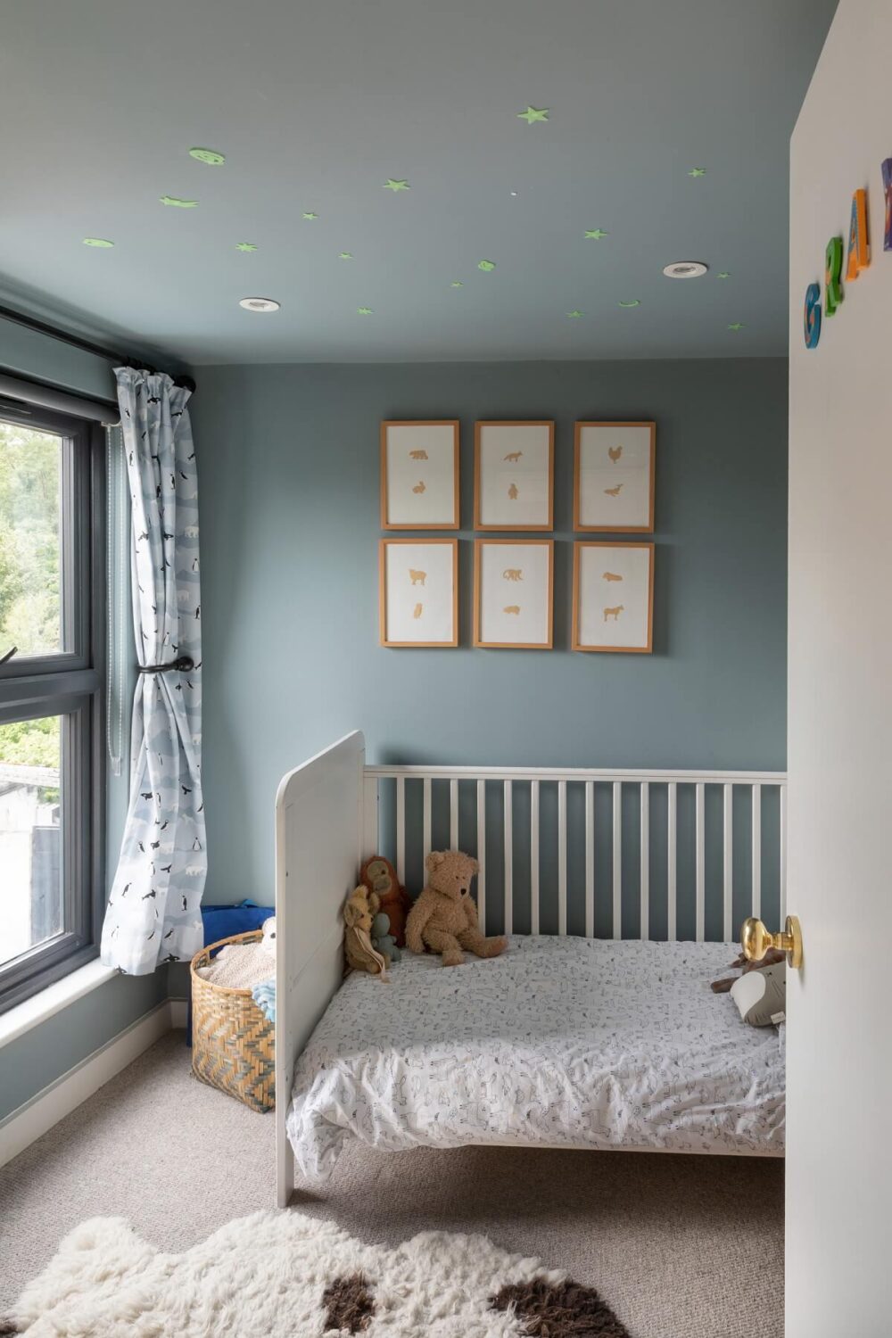 nursery with light blue walls nordroom