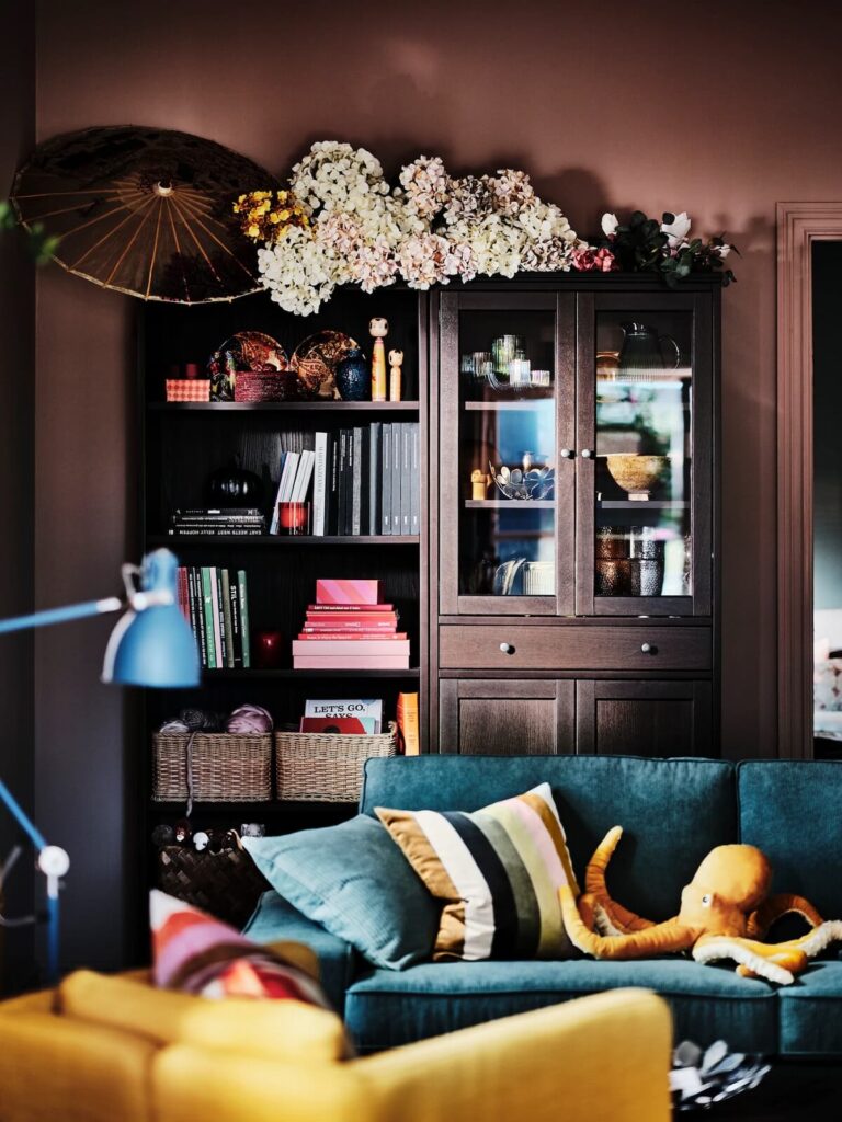 romantic ikea living room pink walls blue sofa dark wood nordroom