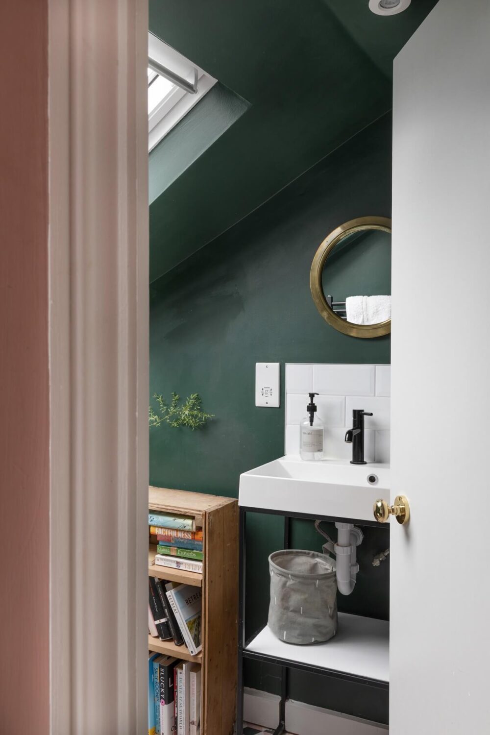small bathroom with green walls and slanted ceiling nordroom
