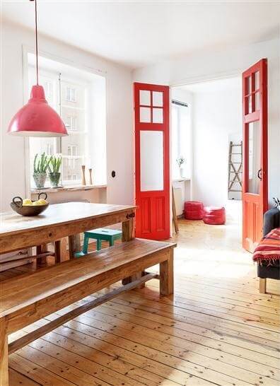 dining room with red painted doors