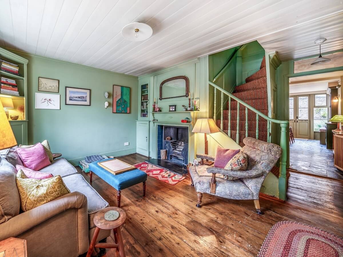 green open plan living room with wooden floor