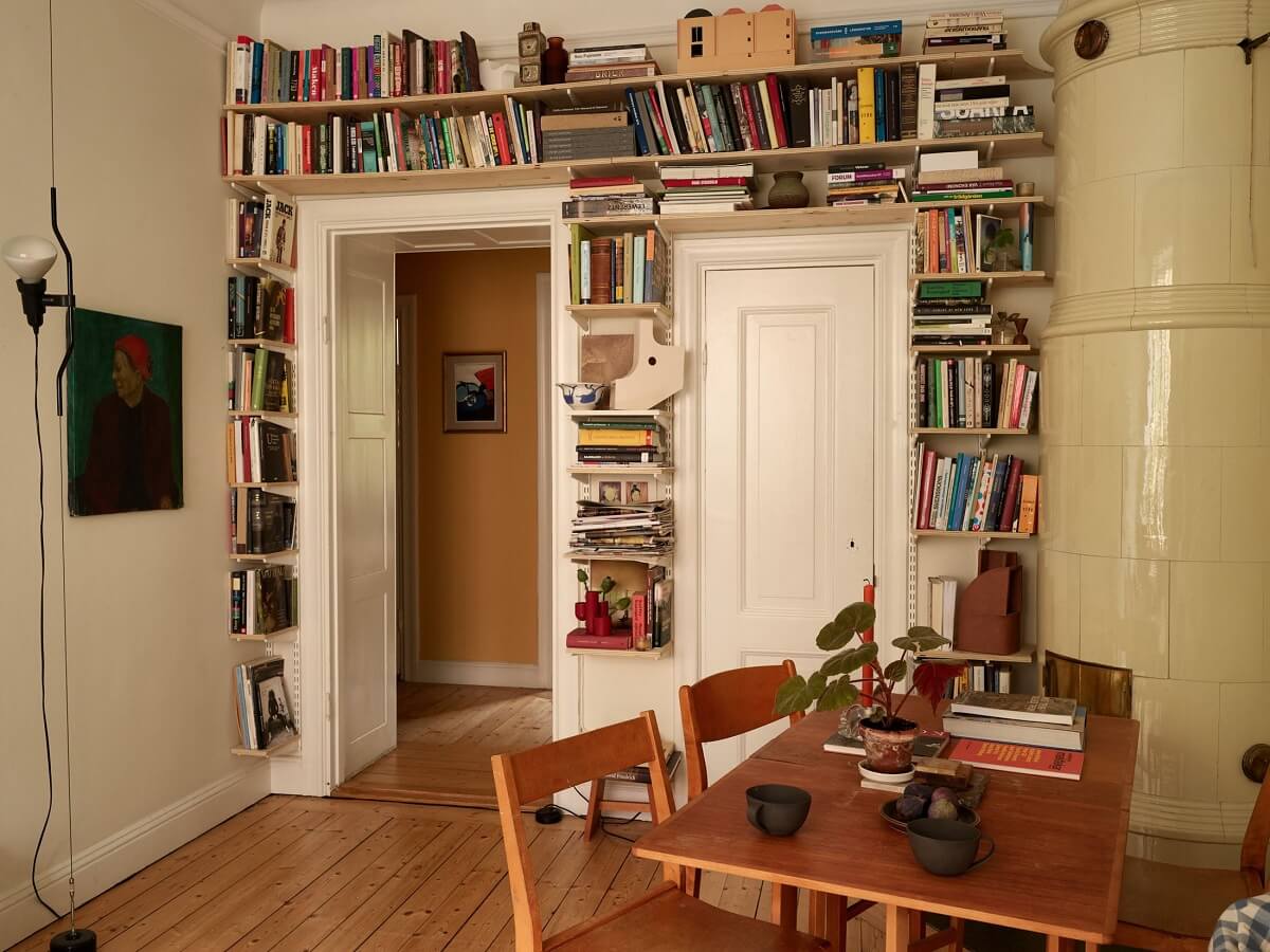 small living room with bookshelves around doorframe