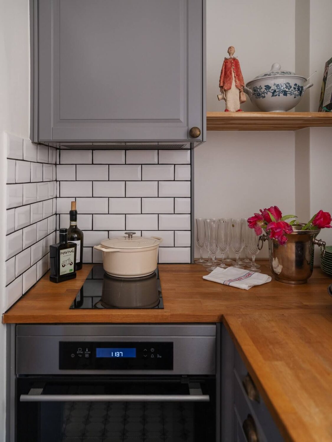 tiny gray kitchen with subway tiles and wooden worktop nordroom