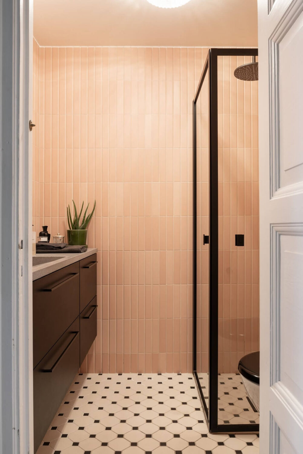 bathroom with pink tiles