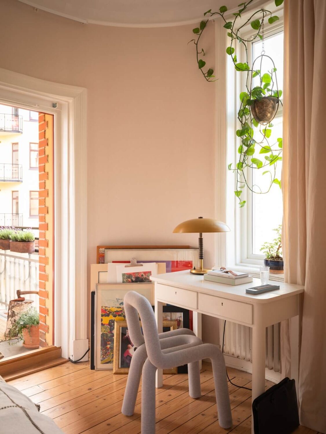 bedroom home office with pastel blue chair