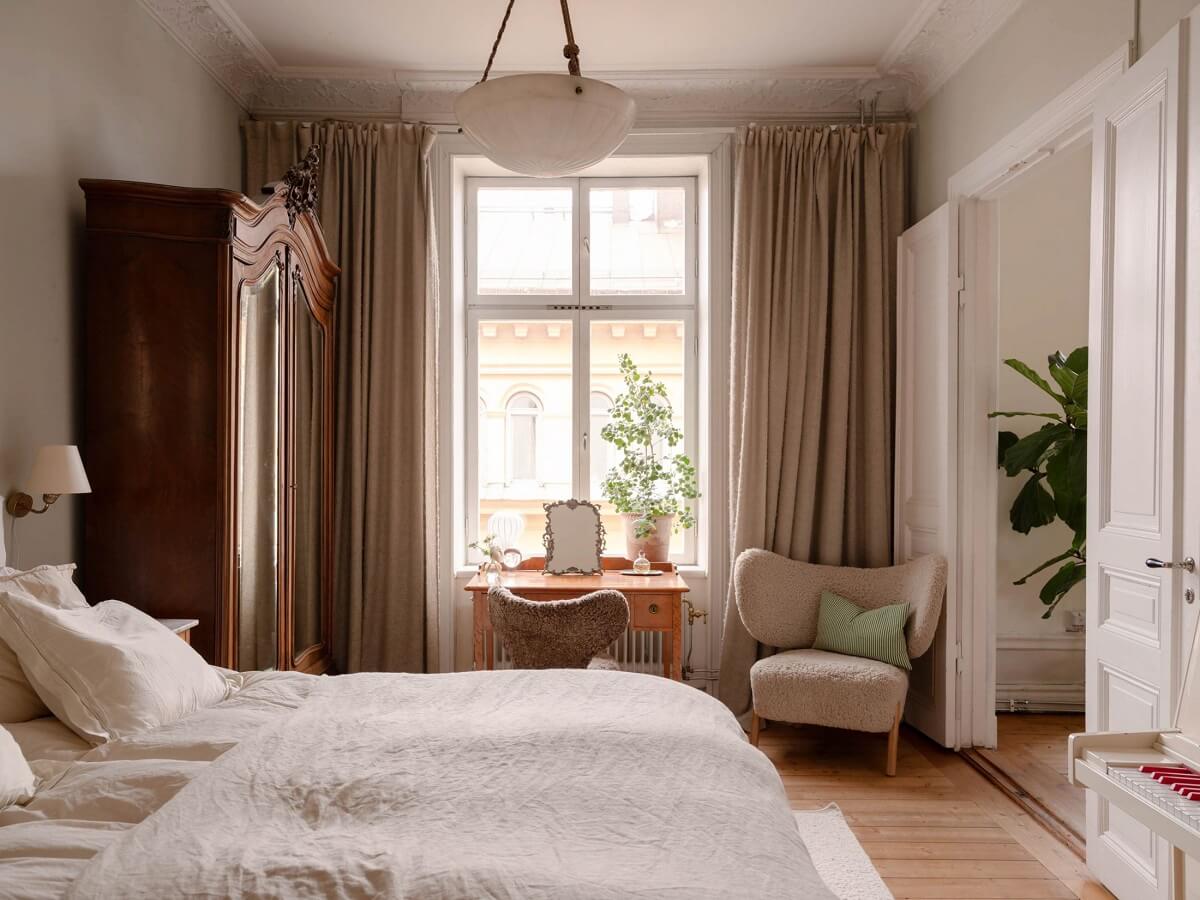 bedroom with antique wardrobe and vanity table