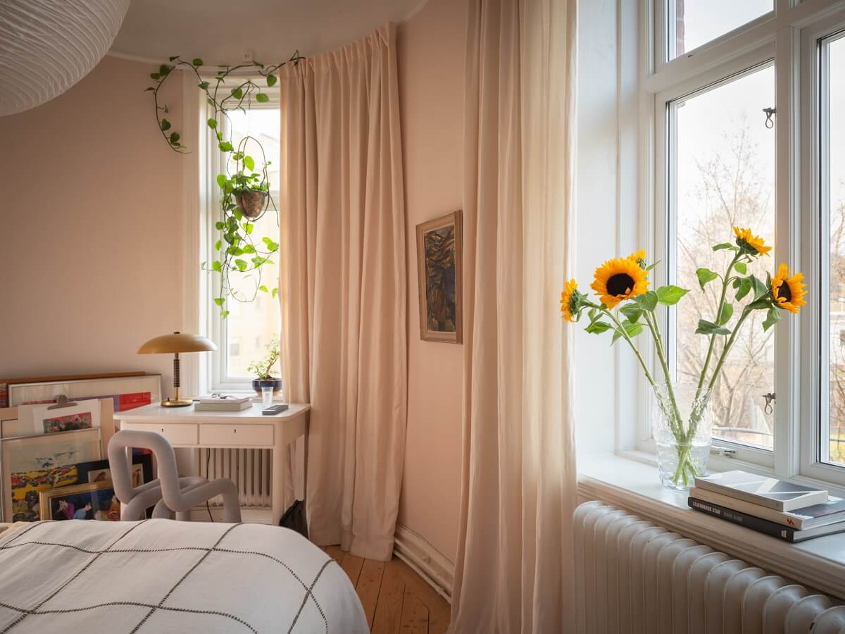 bedroom with small desk and rounded walls