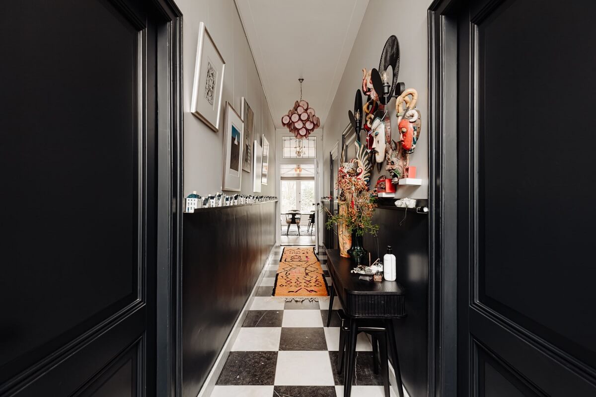 hallway with checkerboard floor tiles