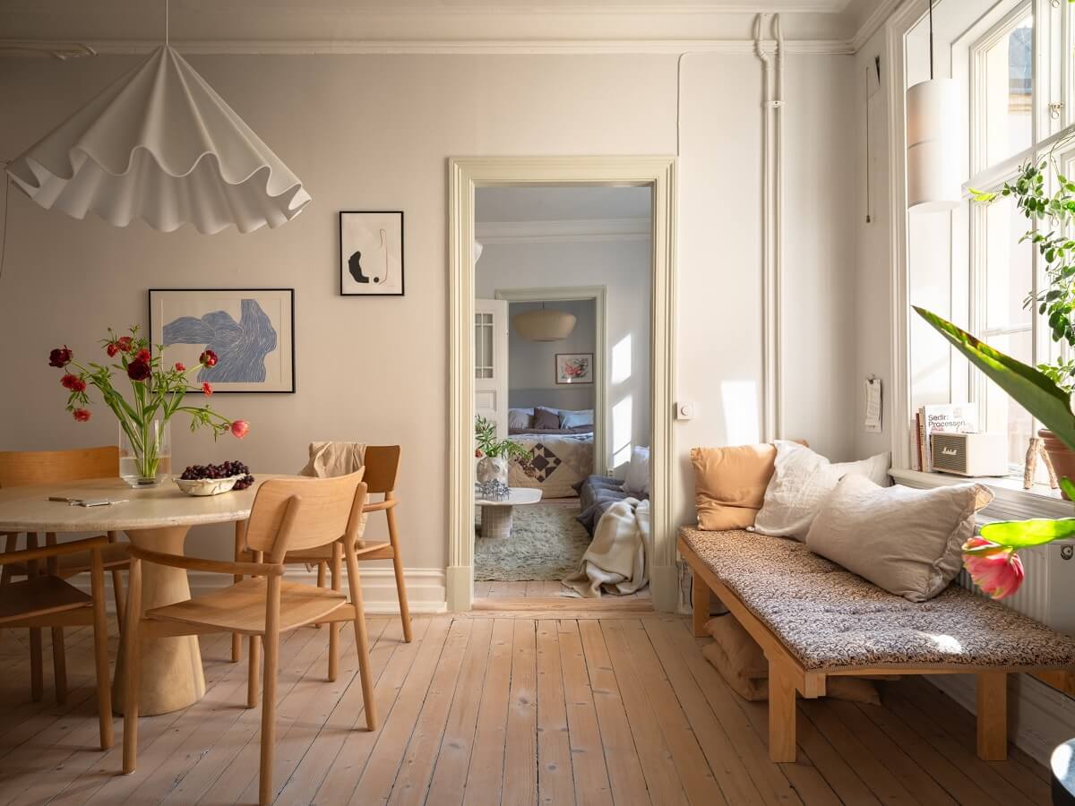 kitchen and dining room with wooden floor and bench