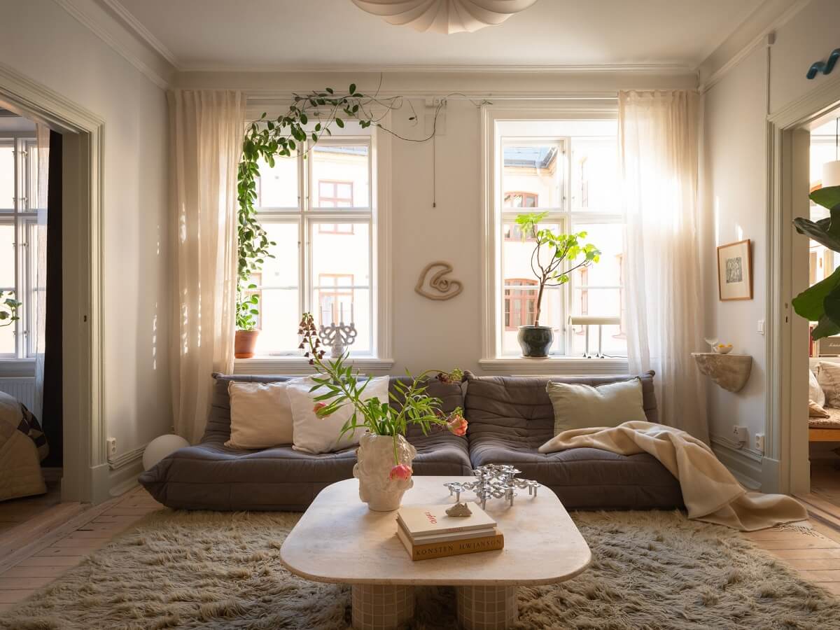 large rug and natural light in a scandinavian living room