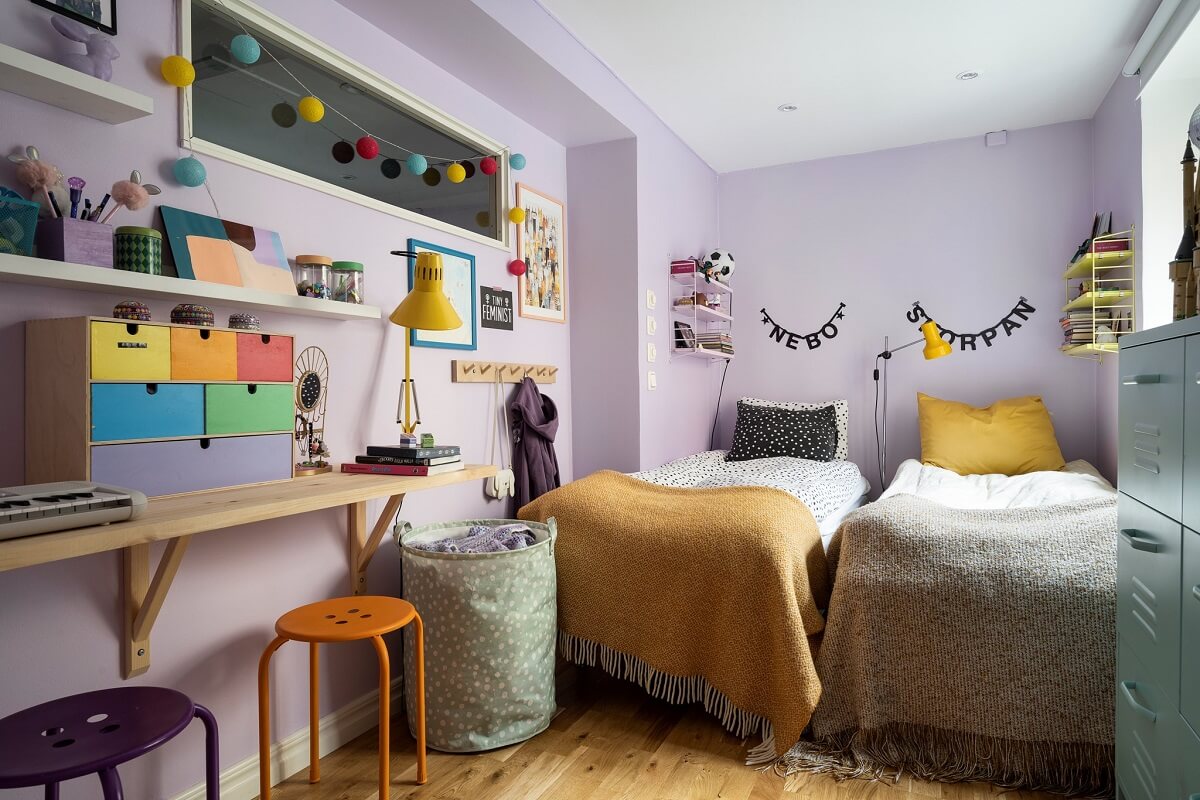 lavender childrens bedroom with wooden diy desk