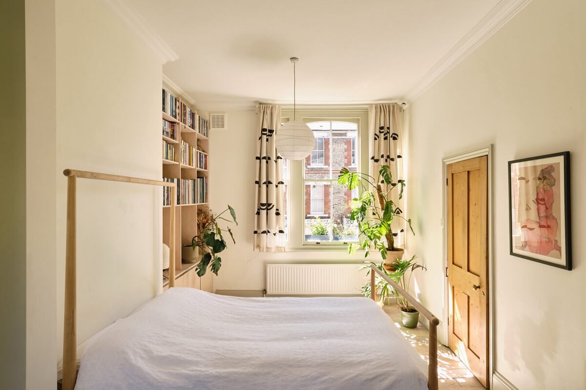 light bedroom with bookcases