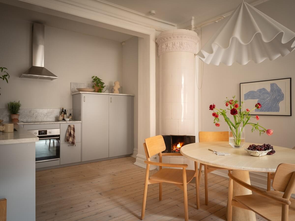 open plan kitchen and dining room with wooden floor