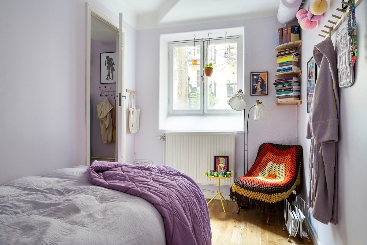 small bedroom with lavender color accents