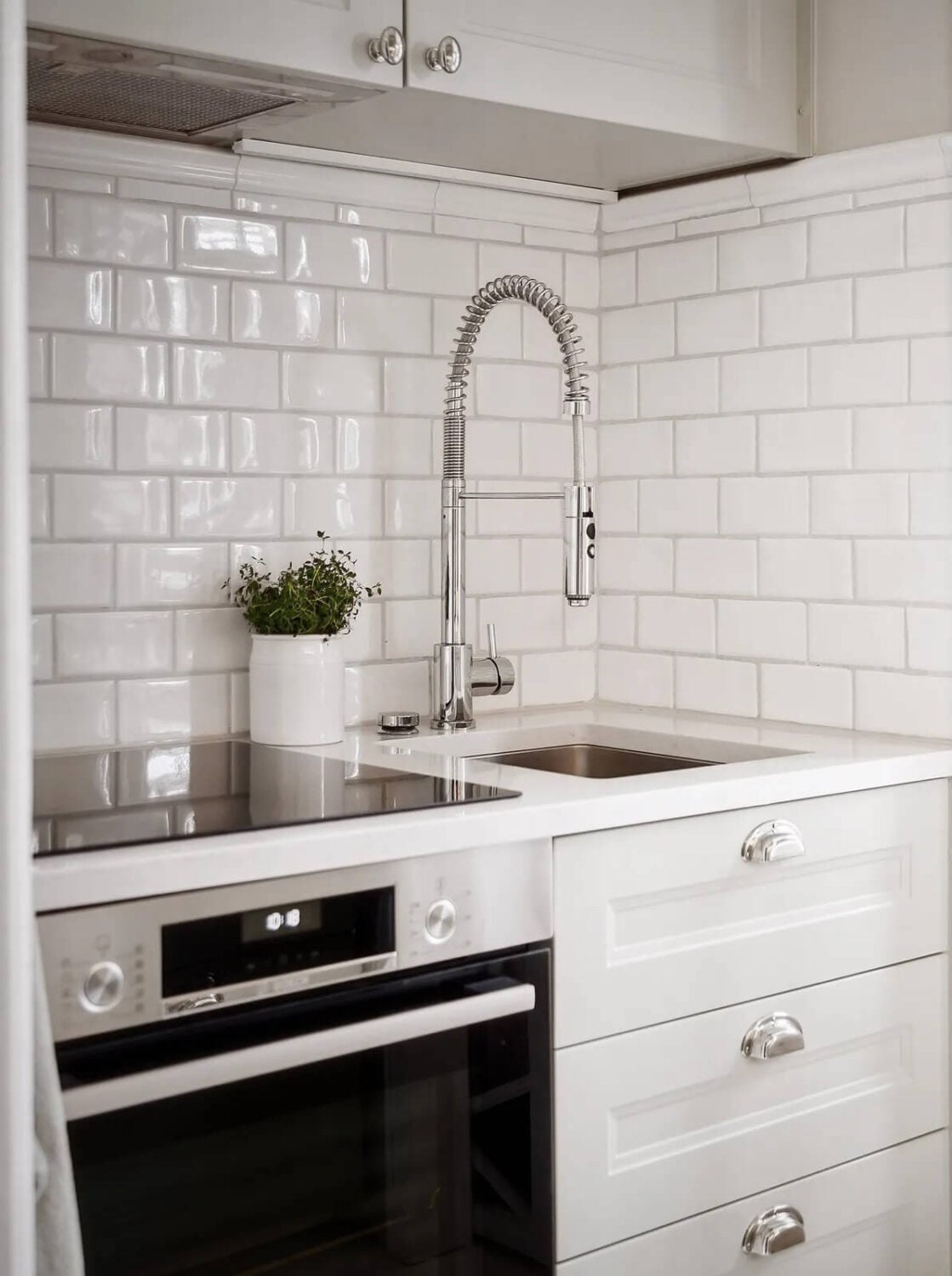 A Swedish Studio Apartment Decorated in a Classic Style 10 small kitchen with white tiles A Swedish Studio Apartment Decorated in a Classic Style